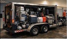 Professional epoxy flooring equipment and grinding machines on trailer in Austin, Texas